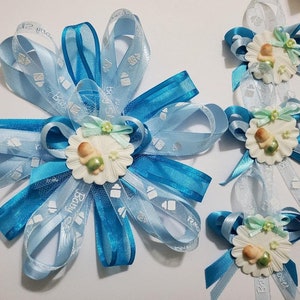 18 épingles pour invités et un corsage pour future maman pour la baby shower .