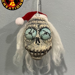 Shrunken Head Christmas ornament with glow in the dark eyes