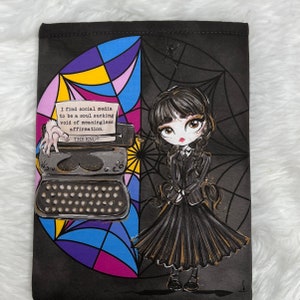 May include: A black and white illustration of a girl with black hair and a black dress standing in front of a typewriter with a quote about social media. The background is a colorful stained glass design with a spider web.