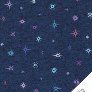 May include: A navy blue fabric with a repeating pattern of white, pink, and blue stars. The stars are all different sizes and have a slightly faded look.