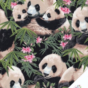 May include: Black fabric with a repeating pattern of pandas in a bamboo forest. The pandas are black and white and are shown in various poses, including cuddling and eating bamboo. Pink flowers are scattered throughout the fabric.
