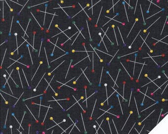 May include: Black fabric with a repeating pattern of white sewing pins with colorful heads. The fabric has a subtle texture.