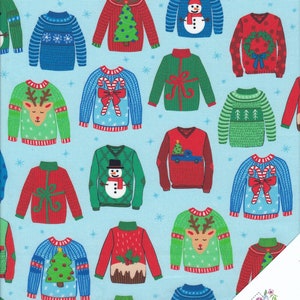 Può includere: Uno sfondo blu con un motivo ripetuto di maglioni natalizi colorati. I maglioni presentano vari disegni, tra cui renne, pupazzi di neve, bastoncini di zucchero e alberi di Natale.