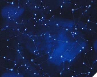 May include: Dark blue fabric with a constellation pattern. White stars and connecting lines are scattered across the fabric, creating a celestial design. The fabric has a slight texture and a dark blue background. The lower right corner has the text "Quilt Shop Ruth Baudisch".