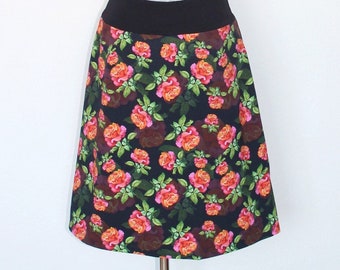 A-line waist skirt, Ökotex cotton jersey, black with pink/orange roses, knee-length