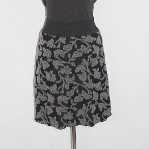 Knee-length skirt in black viscose knit jersey with gray wool tendrils