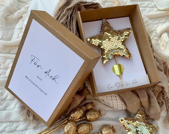 Gift box Christmas with golden star on the stem a Christmas greeting