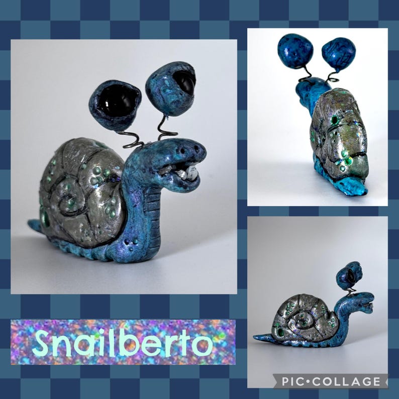 May include: A whimsical sculpture of a snail named "Snailberto" with a blue and silver shell and body. The snail has large, expressive eyes and a smiling mouth. The sculpture is a unique piece of art.