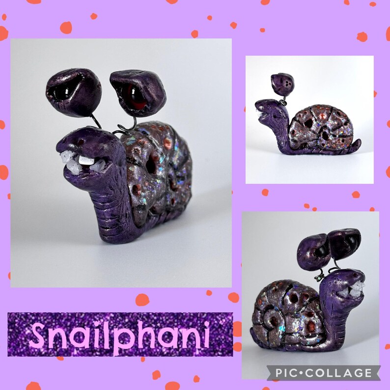 May include: A whimsical purple snail sculpture with a textured shell and large, dark eyes. The snail has a wide grin with visible teeth and is set against a white background. The text "Snailphani" is displayed below the sculpture.