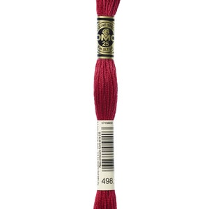 May include: A spool of DMC embroidery floss in colour 498, a deep red. The spool is labelled with the DMC logo and the colour number. The floss is 8 metres (8.7 yards) long.