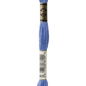 May include: A skein of DMC embroidery floss in colour 3839, a light blue shade. The floss is wound on a white card with a black and gold label that reads "DMC 25 Cotton A Broder", and a barcode.