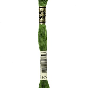 May include: A spool of DMC embroidery floss in shade 905, a dark green colour. The spool is labelled with the DMC logo, the number 25, and the length of the floss in metres and yards.
