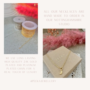 May include: A gold necklace with a crescent moon charm, displayed in a box with the text "PEEKA JEWELLERY". The necklace is made with high quality 24k gold plated and platinum plated chain. The text "ALL OUR NECKLACES ARE HAND MADE TO ORDER IN OUR NOTTINGHAMSHIRE STUDIO" is visible in the background.