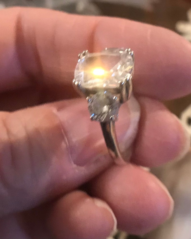 Sterling Silver Size 6 Ring with Sparkly Emerald Cut Cubic Zirconia and two Round Stones on the Sides