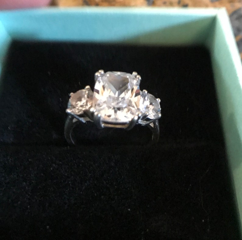 Sterling Silver Size 6 Ring with Sparkly Emerald Cut Cubic Zirconia and two Round Stones on the Sides