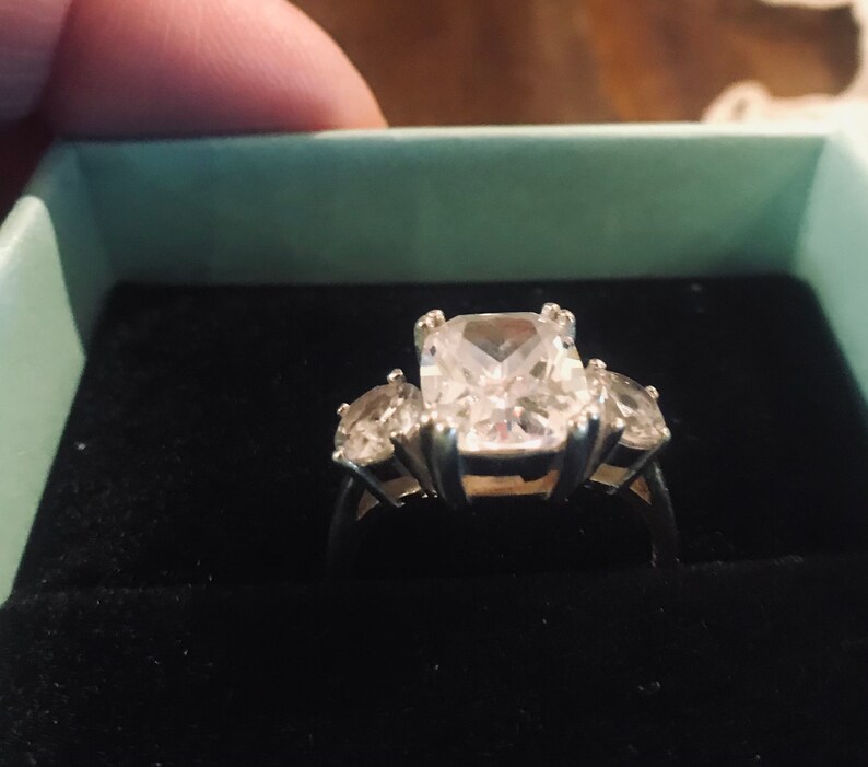Sterling Silver Size 6 Ring with Sparkly Emerald Cut Cubic Zirconia and two Round Stones on the Sides