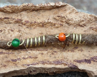 Dreadlock bead: brass and seed.