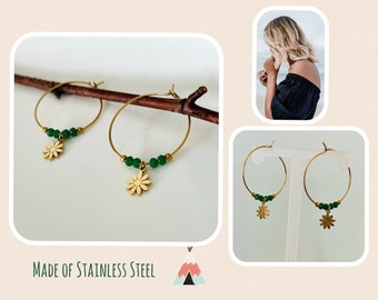 Hoop earrings gold with green stone*Hoop earrings with flower-shaped charm*Hoop earrings gold with pendant*Hoop earrings with small green stones*Hoop earrings flowers