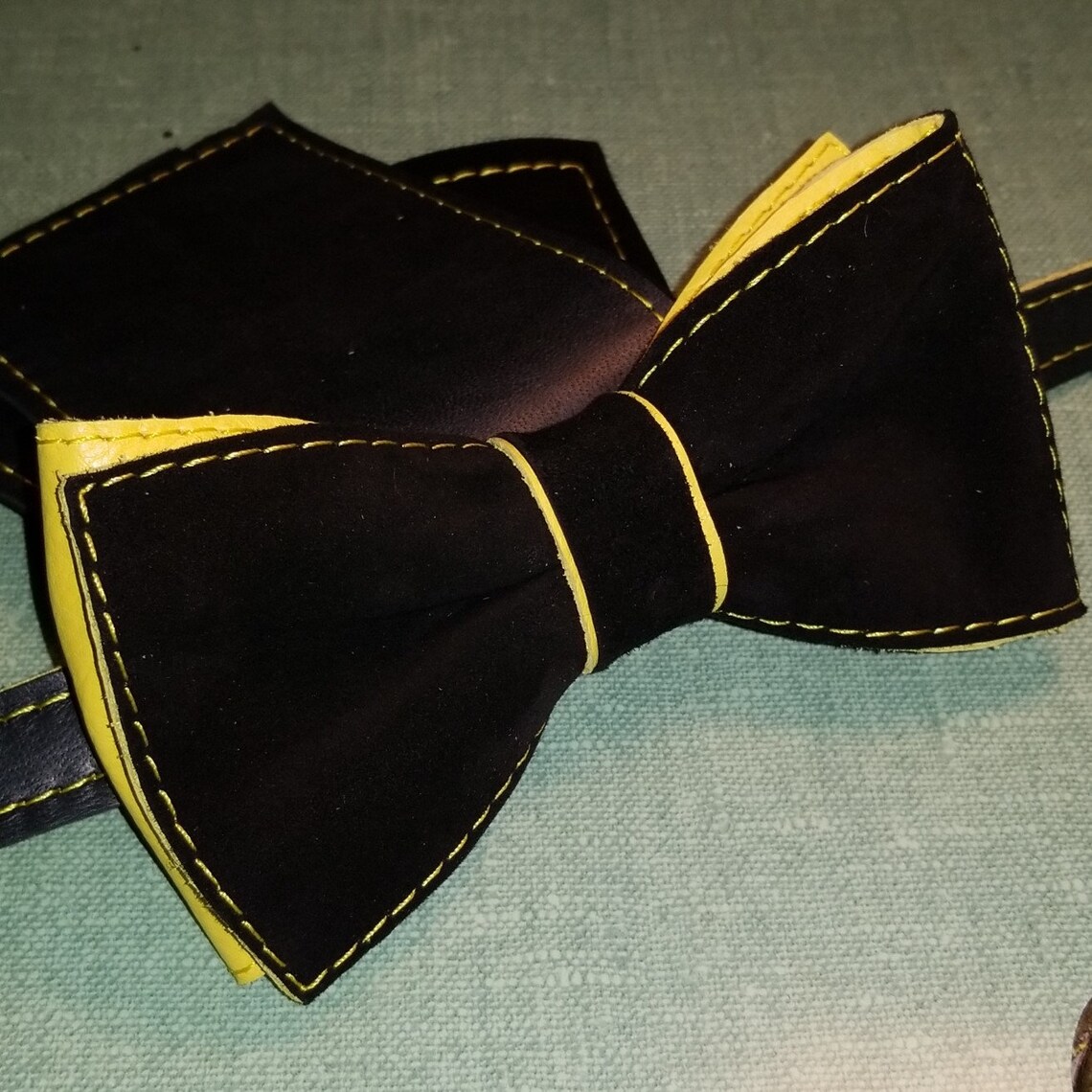 black tux with gold bow tie