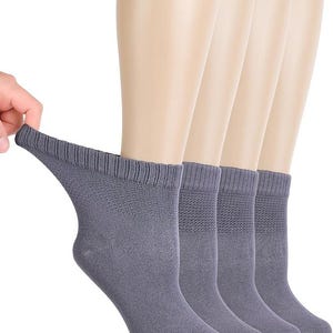 May include: A set of four grey ankle socks featuring a ribbed cuff and a textured knit pattern on the upper section. The socks are shown in a row, with one being pulled slightly to display the stretch and the fabric texture of the material.