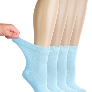 May include: A set of four light blue ankle socks featuring a ribbed cuff design. The socks are made of a soft, knit fabric and are shown in a light, solid color. The material has a consistent texture throughout the body of the sock, providing a simple and functional appearance for everyday use.