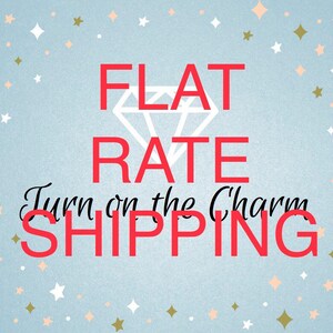 May include: A blue background with white stars and a diamond graphic. The text "FLAT RATE SHIPPING" is in red with the words "Turn on the Charm" in black cursive.