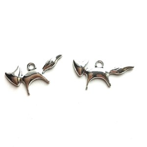 May include: Two silver fox charms with a loop for attaching to a necklace or bracelet.