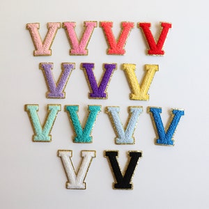 May include: A set of 12 felt letter patches in various colors, each featuring the letter "V" in a bold, uppercase font. The patches are perfect for adding a personalized touch to clothing, bags, or other accessories.