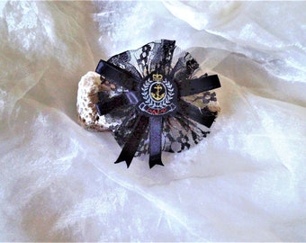 Maritime pin from the 80s made of black lace, decorative textile jewelry for costumes with an anchor