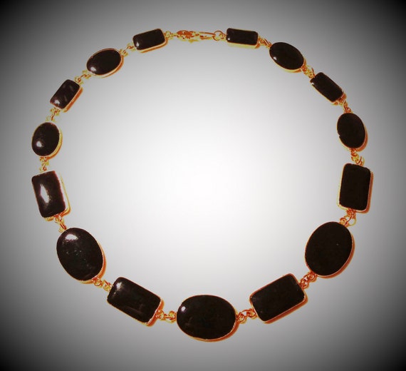 Chain elegant gold-colored with black oval and sq… - image 1