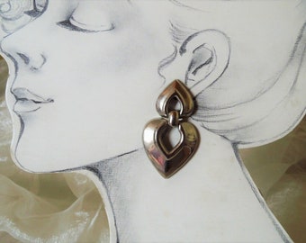 Light, shiny silver or gold-colored ear clips with a large heart on a small heart from the 70s as a gift for women