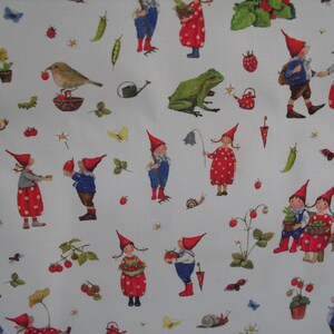 May include: A white fabric featuring a whimsical pattern of gnomes in red hats and polka-dot outfits, interspersed with butterflies, birds, strawberries, and other garden elements. The design is a charming illustration.