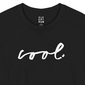 May include: Black t-shirt with the word "cool" in white script across the front. The shirt also has the text "SLEEPINGO" in a smaller font at the top. The t-shirt is made of a soft material.