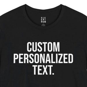 May include: Black t-shirt with white text that reads "CUSTOM PERSONALIZED TEXT."