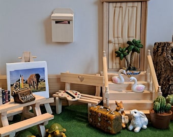 Gnome world, miniatures, suitcase, painting palette, pencil box, rabbit, books, fence, typewriter, easel, bench with heart, palm tree, rabbit