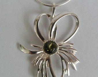 Silver pendant with amber