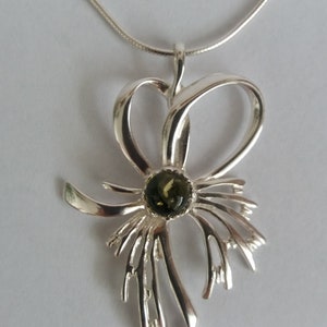 Silver pendant with amber