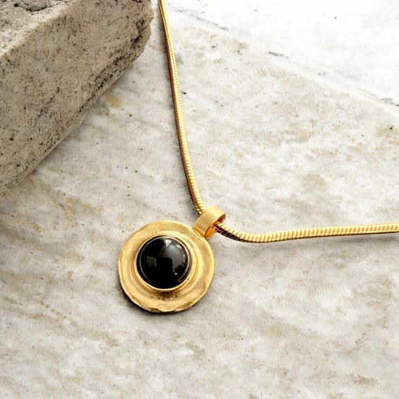 Ebb and Flow Necklace Baltic Gold Black - Snake chain 22K matte gold plated with round pendant with black glass stone and silver leaf
