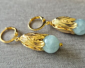 Earrings with tulip leaf-shaped caps, elegant with hooks, golden huggies in real gold- plated and aquamarine beads.