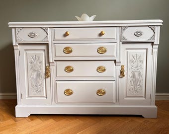 Elegant Edwardian dresser/sideboard in neutral tones.