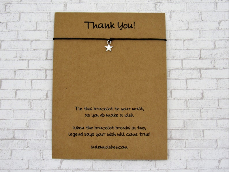 May include: A brown card with the text "Thank You!" and instructions for a wish bracelet. The card says to tie the bracelet to your wrist and make a wish. When the bracelet breaks in two, legend says your wish will come true. The card also includes the website salemwishes.com.