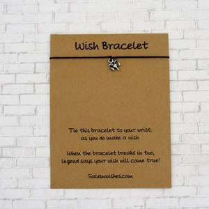 May include: A brown card with the text "Wish Bracelet" printed on it. The card has instructions on how to use the bracelet and a website address: Salemwishes.com.