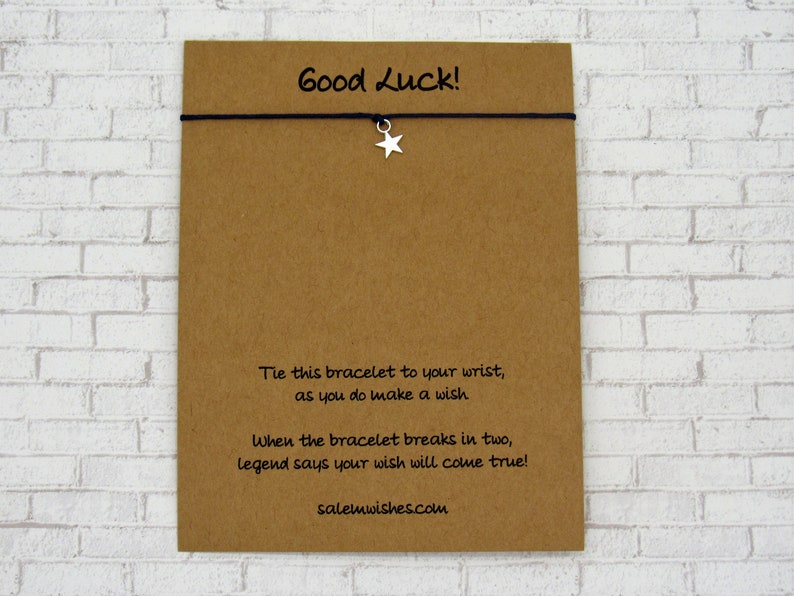 May include: A brown card with the text "Good Luck!" and instructions to tie the bracelet to your wrist and make a wish. When the bracelet breaks, legend says your wish will come true. The website salemwishes.com is printed at the bottom of the card.