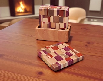 May include: A wooden coaster and a square block set with a geometric pattern of various wood tones, including red, purple, and natural wood. The block set sits in a wooden box. The items are on a wooden table.