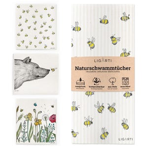 Könnte beinhalten: Ein Set wiederverwendbarer Zellulose-Geschirrtücher mit verschiedenen Designs. Ein Tuch zeigt einen Wolf und eine Biene, ein anderes hat ein Blumenmuster, und andere sind mit gelben und schwarzen Bienen bedeckt. Das Paket trägt den Text "Naturschwammtücher".