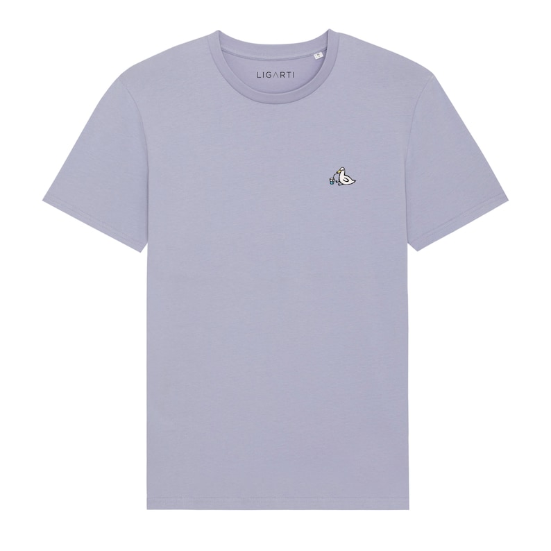 May include: A light purple t-shirt with a small embroidered design of two birds on the left chest. The brand name "LIGARTI" is printed on the tag.