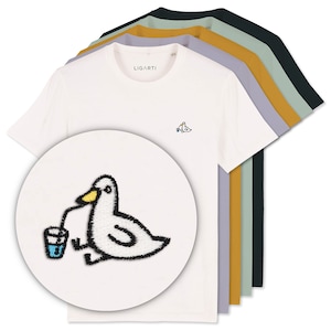 May include: A set of five t-shirts in different colors, featuring a white t-shirt with an embroidered image of a cartoon duck drinking from a glass with a straw. The text "LIGARTI" is printed on the white t-shirt.