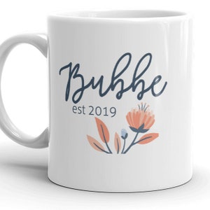 Bubbe est 2019 MUG vF, Isreal Grandma Choose Year, first time grandmother, pregnancy reveal, new baby announcement, flowers