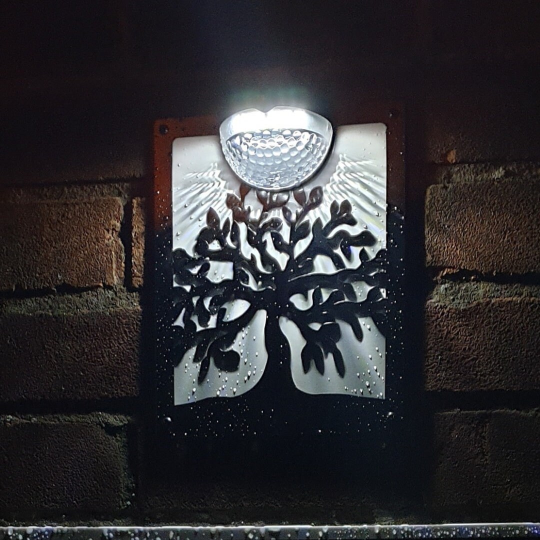 Solar light wall plaque deals