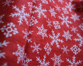 Flannel fabric patchwork red-grounded with snow crystals